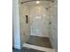 Modern bathroom featuring a marble-look walk-in shower with seat and stylish fixtures at 4811 14Th E Ave, Bradenton, FL 34208