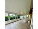 Large sunroom with multiple windows offering natural light and backyard views at 4811 14Th E Ave, Bradenton, FL 34208