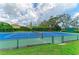 Enjoy a game of tennis on this community court featuring a green surface and fully enclosed fencing for recreational enjoyment at 4811 14Th E Ave, Bradenton, FL 34208