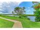 Scenic waterside walking path offers residents a serene escape to connect with nature and enjoy the calming views at 4811 14Th E Ave, Bradenton, FL 34208