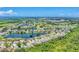 Community aerial shot overlooking homes surrounding lakes, lush golf courses, and interconnected waterways at 5142 51St W Ln, Bradenton, FL 34210