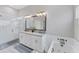 Bathroom features a double vanity with granite counters, a walk-in shower, and a separate jacuzzi tub at 5142 51St W Ln, Bradenton, FL 34210