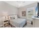 Bright bedroom featuring a queen sized bed, neutral decor, and ceiling fan at 5142 51St W Ln, Bradenton, FL 34210