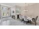 Formal dining room with elegant chandelier, a built-in buffet with wine fridge and direct access to the foyer at 5142 51St W Ln, Bradenton, FL 34210