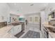 Bright kitchen features granite countertops, stainless steel appliances, and wood-look tile flooring at 5142 51St W Ln, Bradenton, FL 34210