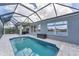 Relax by the screened-in pool with lake views, perfect for outdoor entertainment and relaxation at 5142 51St W Ln, Bradenton, FL 34210