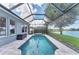 Screened in pool and spa overlooks the lush landscaping and tranquil lake views at 5142 51St W Ln, Bradenton, FL 34210