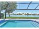 Enjoy stunning lake views from this home's screened-in pool and spa area at 5142 51St W Ln, Bradenton, FL 34210