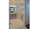 Well-lit bathroom featuring a glass enclosed shower, modern vanity, and white tiled floor at 5219 Barnett Cir, Bradenton, FL 34211
