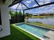 Secluded backyard pool, surrounded by green space and with views of the tranquil lake at 5219 Barnett Cir, Bradenton, FL 34211