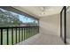 Enjoy the outdoors from this private, screened-in balcony with serene views of the tropical landscape at 5255 Lake Village Dr # 40, Sarasota, FL 34235