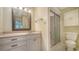Updated bathroom features a shower, vanity and a well-lit mirror at 5255 Lake Village Dr # 40, Sarasota, FL 34235