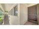 Entrance to the condo with a screened in door and a view of the tropical community at 5255 Lake Village Dr # 40, Sarasota, FL 34235