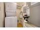 Cozy utility room featuring a stacked washer and dryer with utility connections at 5255 Lake Village Dr # 40, Sarasota, FL 34235
