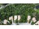 Aerial view of residences featuring well-maintained yards, tile roofs and enclosed patios backing to wooded areas at 6744 Hickory Hammock Cir, Bradenton, FL 34202
