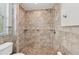 Elegant bathroom featuring tiled walls and floors, and a glass-enclosed shower at 6744 Hickory Hammock Cir, Bradenton, FL 34202