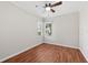 Bedroom featuring wood floors, ceiling fan, window with blinds, and natural light at 6744 Hickory Hammock Cir, Bradenton, FL 34202