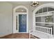 Welcoming front entrance with a stylish door, decorative windows and a cozy bench at 6744 Hickory Hammock Cir, Bradenton, FL 34202