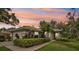 Charming exterior view of the home with manicured landscaping, walkway, and a glimpse of the welcoming facade at 6744 Hickory Hammock Cir, Bradenton, FL 34202