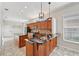 Open kitchen featuring custom wood cabinets, granite countertops and stainless appliances at 6744 Hickory Hammock Cir, Bradenton, FL 34202