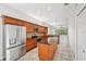 Spacious kitchen boasting dark granite counters and stainless steel appliances at 6744 Hickory Hammock Cir, Bradenton, FL 34202