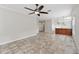 Open-concept living room and kitchen with tile floors and a breakfast bar at 6744 Hickory Hammock Cir, Bradenton, FL 34202