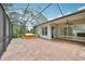 Covered, screened-in patio offering outdoor space with hot tub and entertainment space at 6744 Hickory Hammock Cir, Bradenton, FL 34202