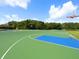 Community basketball court with multiple hoops, perfect for recreational games at 6811 Honeysuckle Trl, Lakewood Ranch, FL 34202