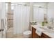 Bathroom with shower, tub, sink, and a large mirror at 6811 Honeysuckle Trl, Lakewood Ranch, FL 34202