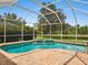 Screened-in pool and patio with a view of a pond at 6811 Honeysuckle Trl, Lakewood Ranch, FL 34202