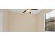 Neutral bedroom featuring a window and ceiling fan at 7140 Marsh View Ter, Bradenton, FL 34212