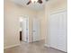 Neutral bedroom featuring tile flooring and a double door closet at 7140 Marsh View Ter, Bradenton, FL 34212