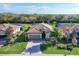 Beautiful single-Gathering home featuring tile roof, brick driveway and tropical landscaping at 7140 Marsh View Ter, Bradenton, FL 34212