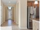 Bright foyer area with decorative glass front door and neutral color palette at 7140 Marsh View Ter, Bradenton, FL 34212