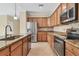 Well-equipped kitchen featuring stainless steel appliances and granite countertops at 7140 Marsh View Ter, Bradenton, FL 34212