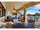 Relaxing outdoor lounge with tables and chairs overlooking the pool area offers a comfortable space at 7140 Marsh View Ter, Bradenton, FL 34212