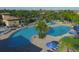Stunning aerial view of a community pool with lush landscaping and comfortable lounge areas at 7140 Marsh View Ter, Bradenton, FL 34212