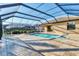 Stunning screened-in pool and spa, seamlessly integrated with the home at 7140 Marsh View Ter, Bradenton, FL 34212