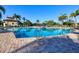 Inviting community pool with clear blue water and ample seating for relaxation under the sun at 7140 Marsh View Ter, Bradenton, FL 34212