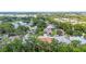 Scenic aerial view of a residential neighborhood with mature trees, well-maintained homes, and lush greenery at 743 Stonecrest Dr, Sarasota, FL 34232