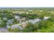 Neighborhood aerial view featuring mature trees, well-maintained homes, and a lush, green landscape at 743 Stonecrest Dr, Sarasota, FL 34232