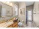 Bathroom featuring a granite countertop vanity, light colored walls, and a shower at 743 Stonecrest Dr, Sarasota, FL 34232