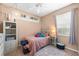 Cozy bedroom with natural light, light colored walls, and decorative accents at 743 Stonecrest Dr, Sarasota, FL 34232