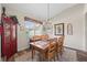 Dining room features wood floors and a chandelier at 743 Stonecrest Dr, Sarasota, FL 34232