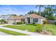 Inviting single-Gathering home with well-kept lawn and landscaping, showcasing its classic architectural details at 743 Stonecrest Dr, Sarasota, FL 34232