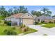 Charming single-story home showcasing a well-manicured lawn, attached garage, and inviting curb appeal at 743 Stonecrest Dr, Sarasota, FL 34232