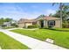 Beautiful single-story home with a well-kept lawn and landscaping at 743 Stonecrest Dr, Sarasota, FL 34232