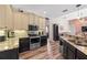 Kitchen with stainless steel appliances, granite countertops, and wood flooring at 743 Stonecrest Dr, Sarasota, FL 34232