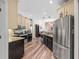 Kitchen boasts stainless steel appliances, granite countertops, and seamlessly connects to the living area at 743 Stonecrest Dr, Sarasota, FL 34232