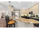 Bright kitchen featuring granite countertops, modern appliances, and a breakfast bar at 743 Stonecrest Dr, Sarasota, FL 34232